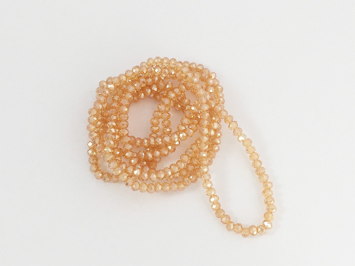 PERLA VETRO SFACET.MM.3×4 GOLD.SHADO
